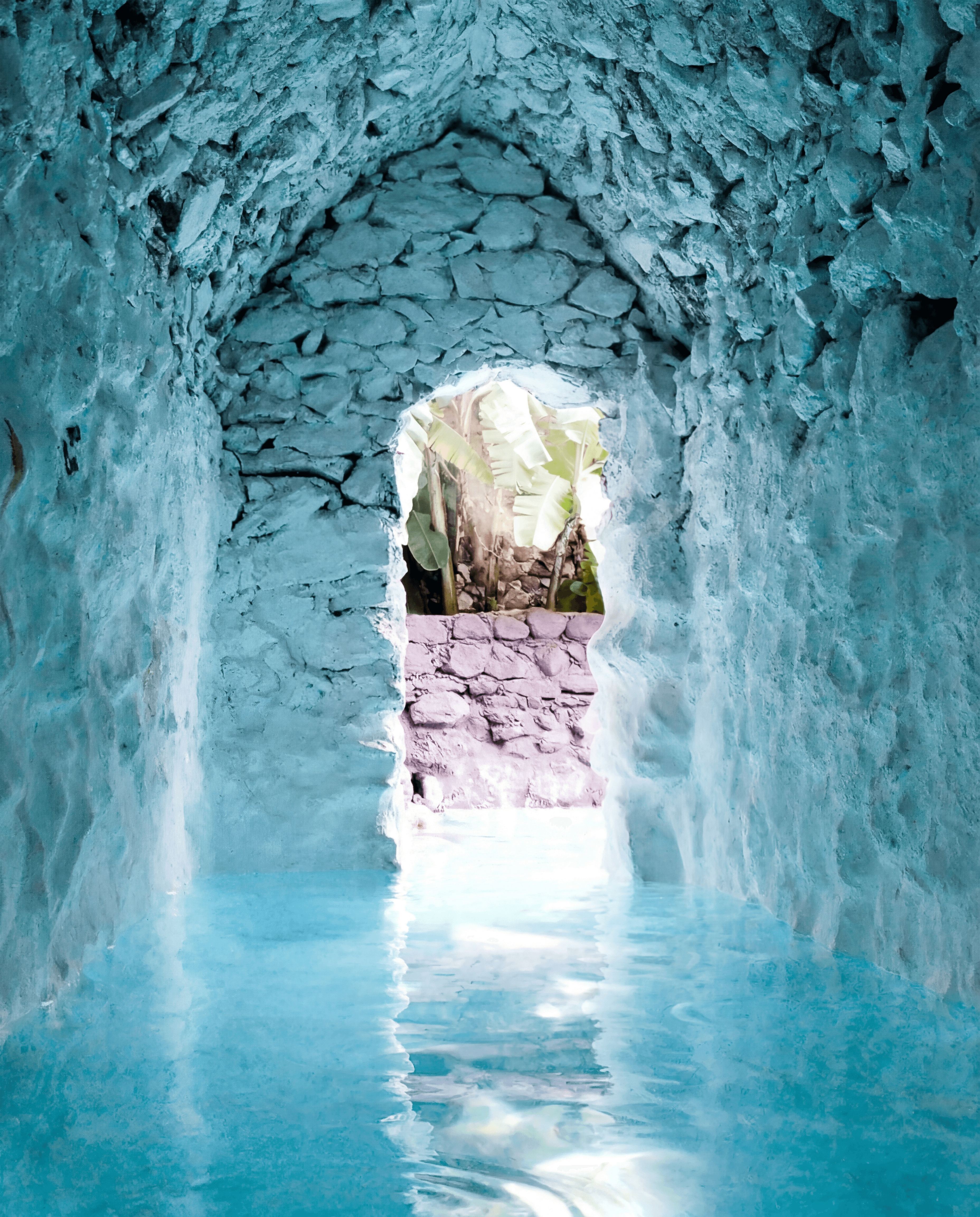 Vaulted stone passage leading into the Mayan Baths thermal pools