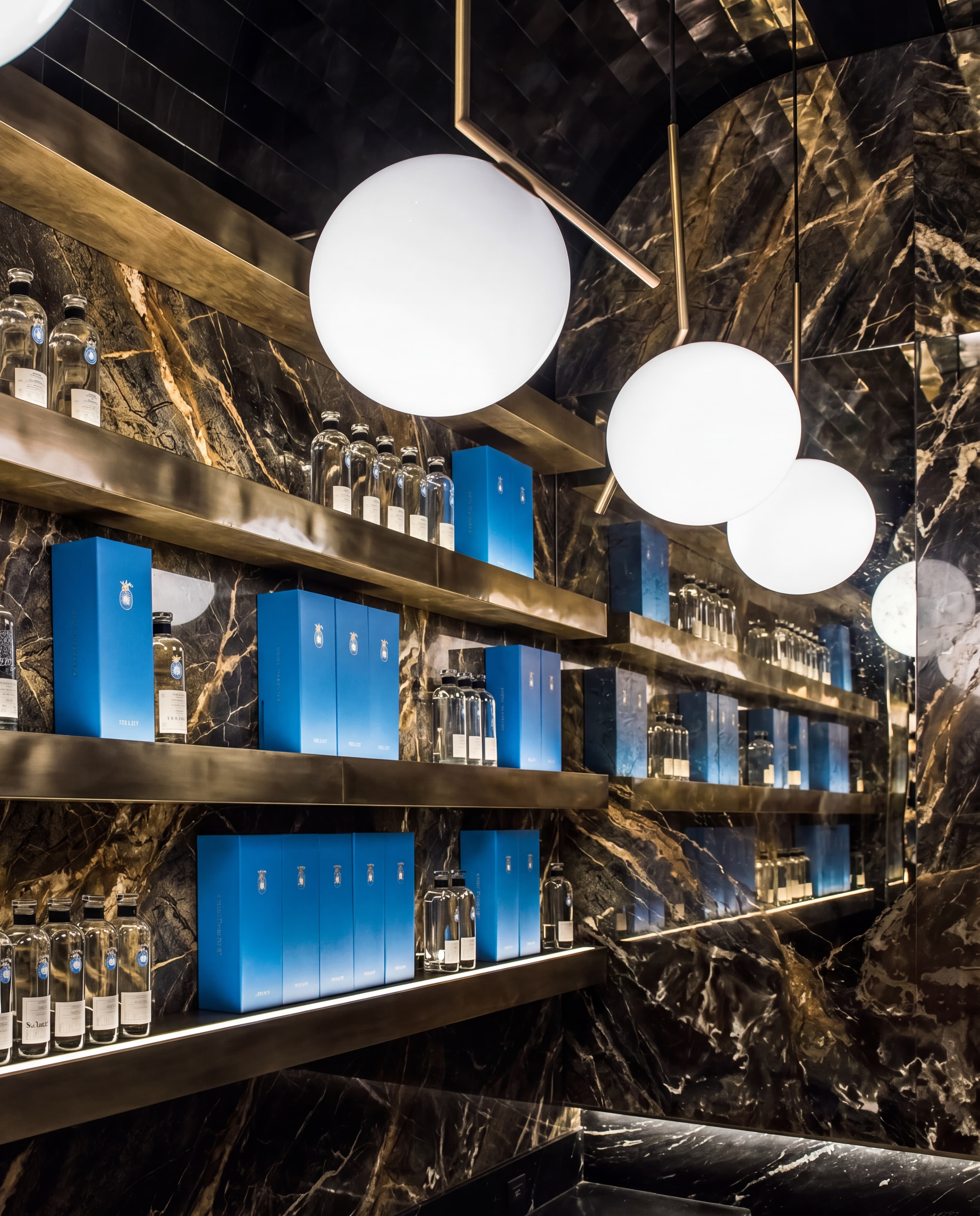 Casa Dragones tasting room interior with backlit tequila bottles